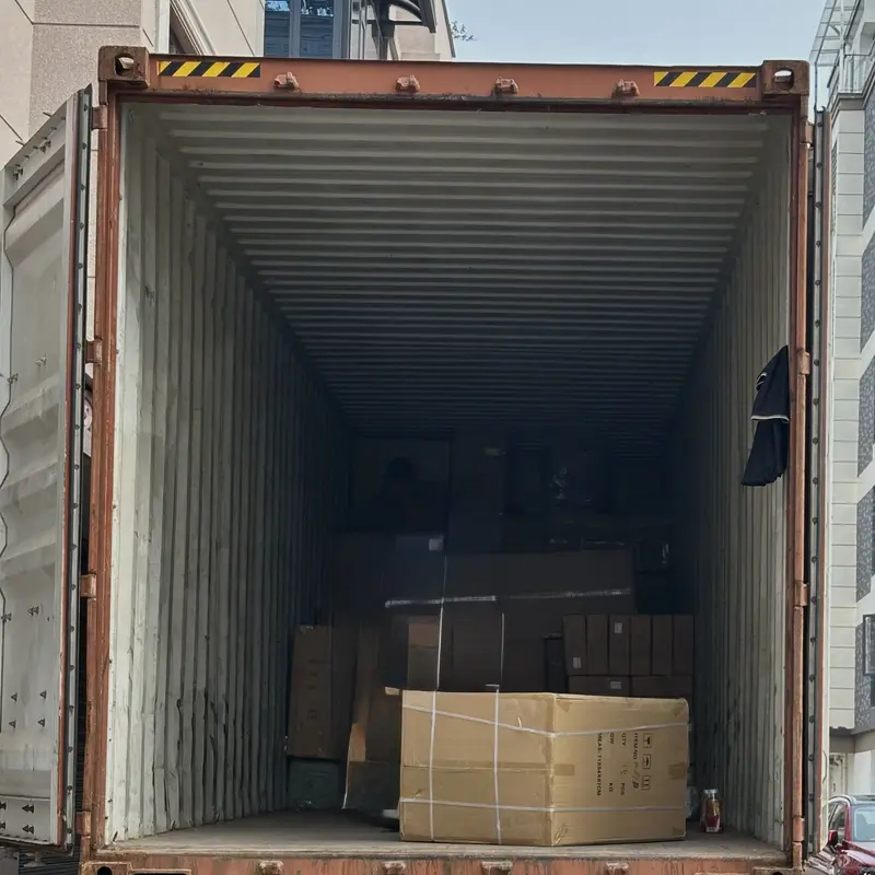Open container on a truck, partly loaded with cartons